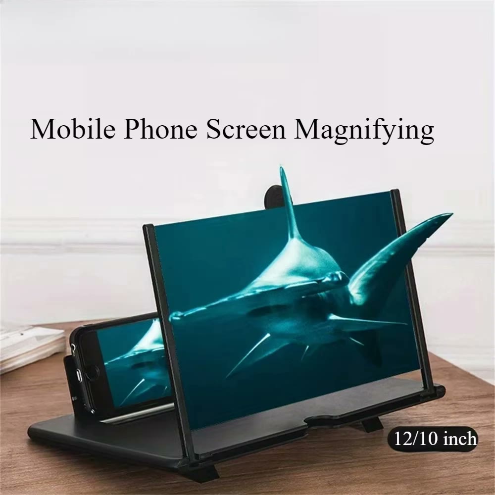 The black folding magnifier holding a phone, enlarging a shark video across the wide lens
